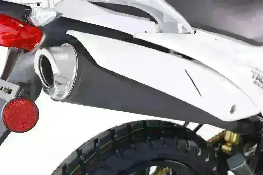 Close-up of TBR7D 250cc motorcycle rear tire, exhaust, and taillight