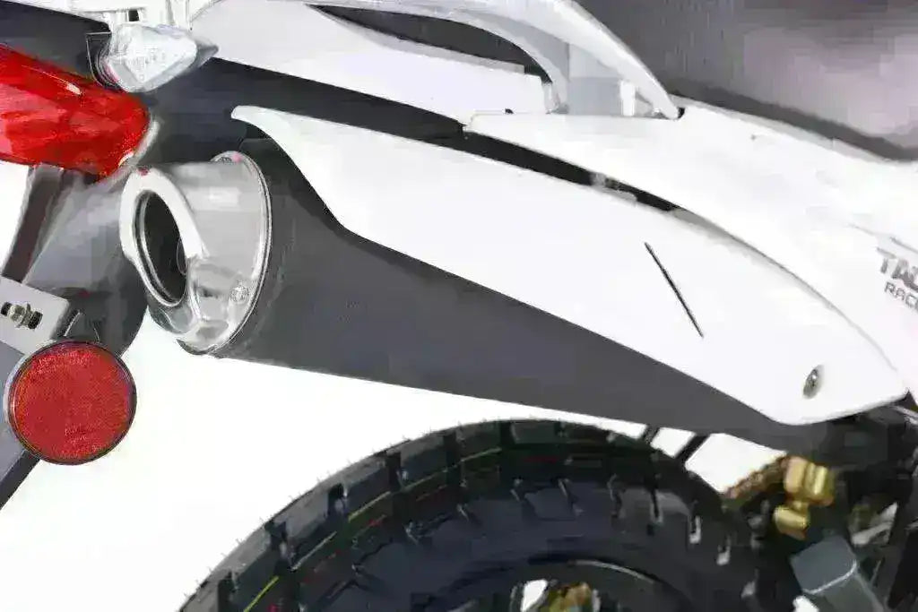 Close-up of TBR7D 250cc motorcycle rear tire, exhaust, and taillight