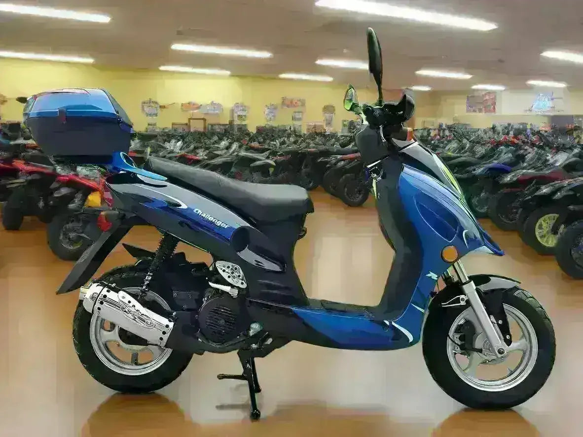 Blue 150cc street-legal scooter with rear storage box on showroom floor