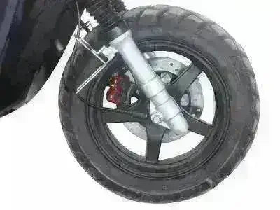 Close-up of IceBear Vision 50 scooter front wheel and brake, Q9 PowerSports USA