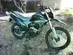 Black and green street-legal Hawk DLX 250 motorcycle parked outdoors