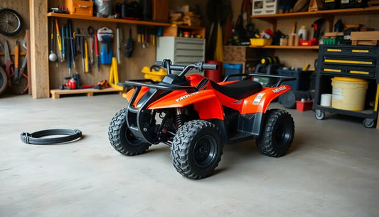 Red youth ATV with off-road tires parked in a well-organized garage workshop
