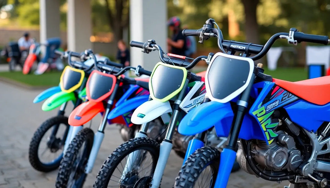 Row of colorful youth dirt bikes for beginners parked outdoors