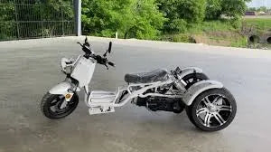 White 150cc Maddog trike scooter with three wheels parked on concrete outdoors