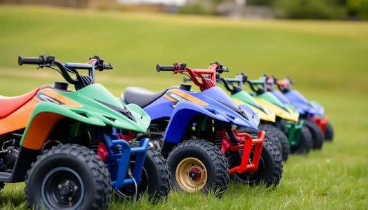 Colorful kids ATVs lined up on grass, outdoor youth quad bikes ready for riding