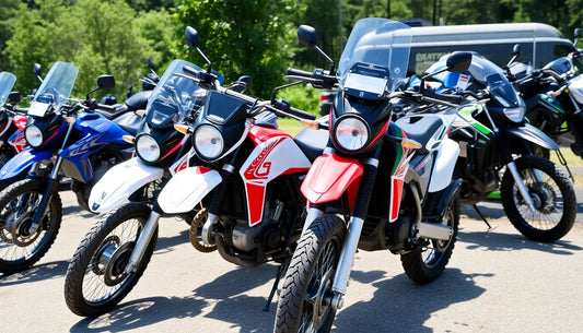 Row of dual sport dirt bikes with windshields parked outdoors on sunny day