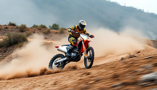 Rider on dirt bike speeding through dusty, rugged off-road trail with hills in background