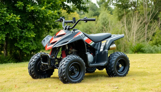 Black and red youth ATV with rugged tires on grass, surrounded by green trees, kids power sports vehicle