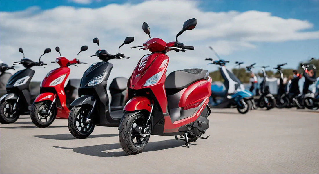 Red and black gas scooters parked outdoors on pavement under a blue sky