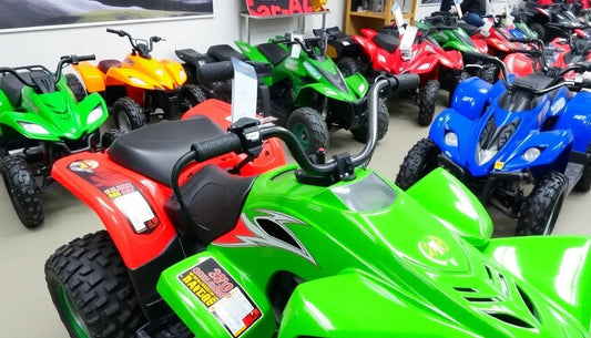 Colorful ATVs lined up in a showroom, featuring green, red, blue, and orange models