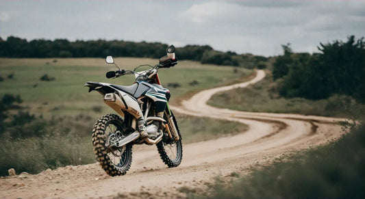 Dirt bike on winding trail, off-road motorcycle with knobby tires in rural outdoor setting