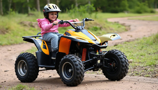 Smiling child riding yellow kids ATV on a dirt trail outdoors, wearing helmet and pink jacket