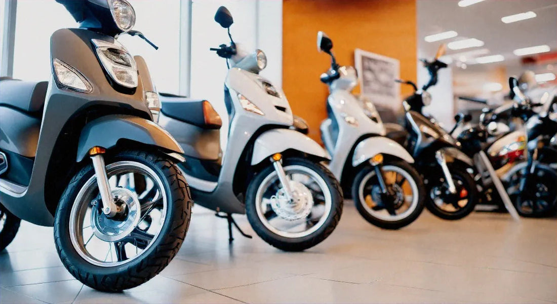 Row of modern scooters on showroom floor, affordable scooters for sale