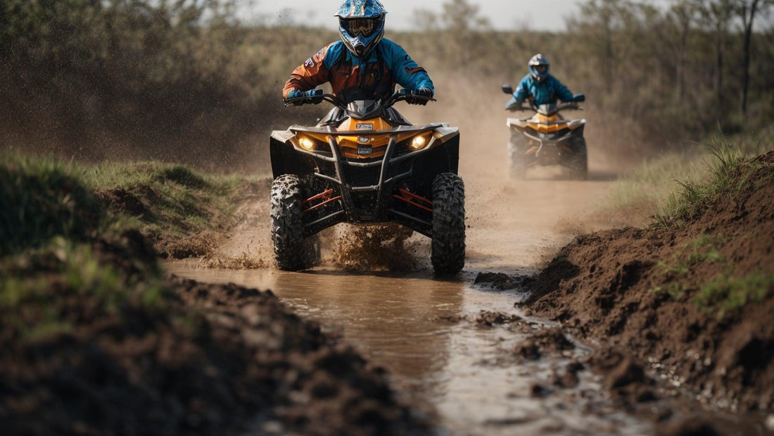 Two riders driving ATVs through a muddy trail, splashing water and dirt outdoors