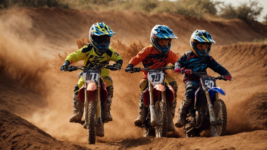 Kids riding dirt bikes on a sandy motocross track, wearing helmets and racing gear