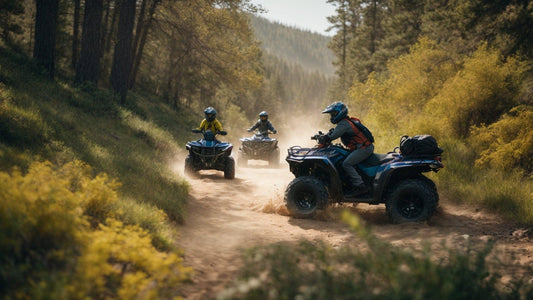 Group riding ATVs on a dirt trail through forested hills, kicking up dust.