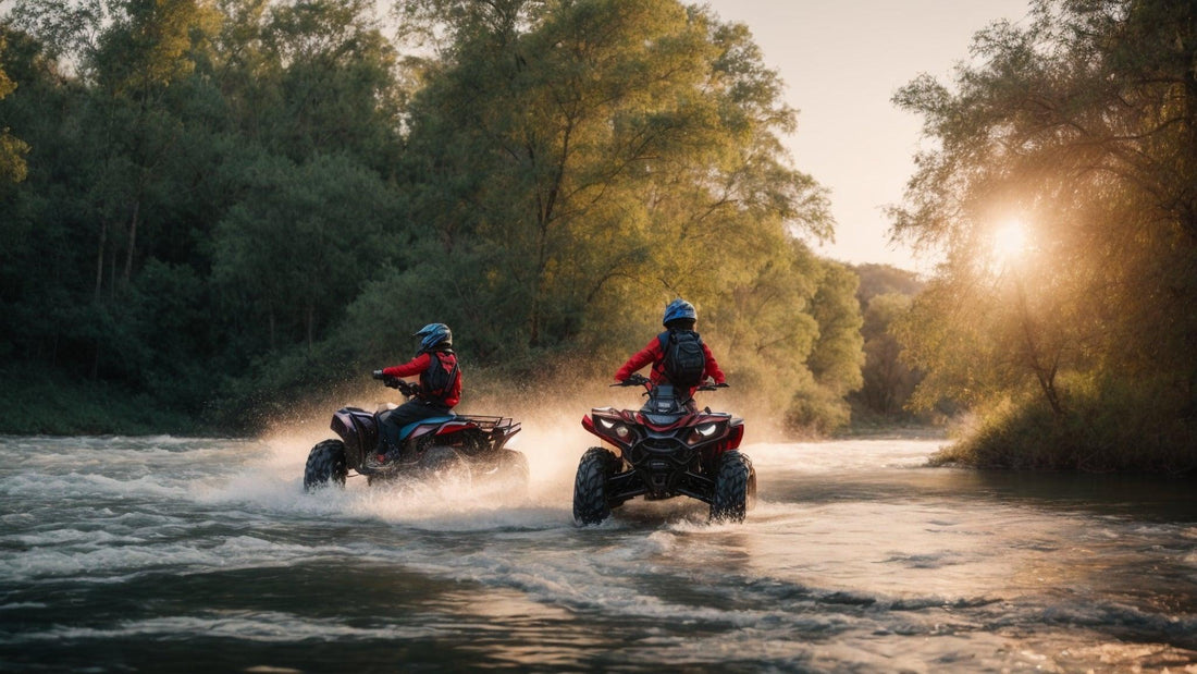 Two people riding ATVs through a river surrounded by trees at sunset