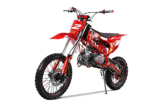 Red motocross dirt bike with knobby tires and number 2 decals on white background