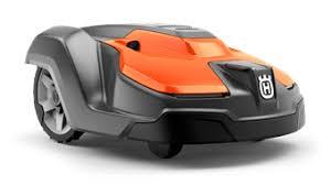 Orange and black Husqvarna Automower robotic lawn mower for automated grass cutting