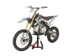 125cc dirt bike with off-road tires and gold front forks on a stand, shown in studio setting