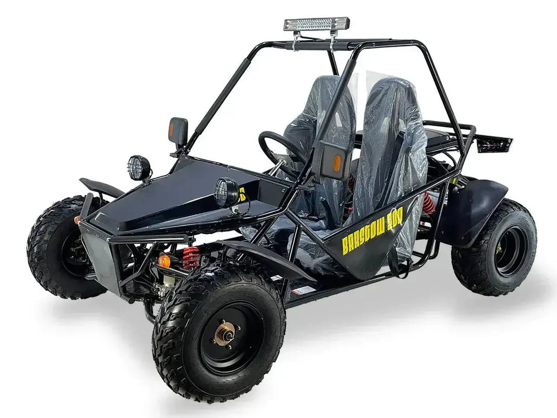 Black off-road go-kart with roll cage, two seats, knobby tires, and front LED lights