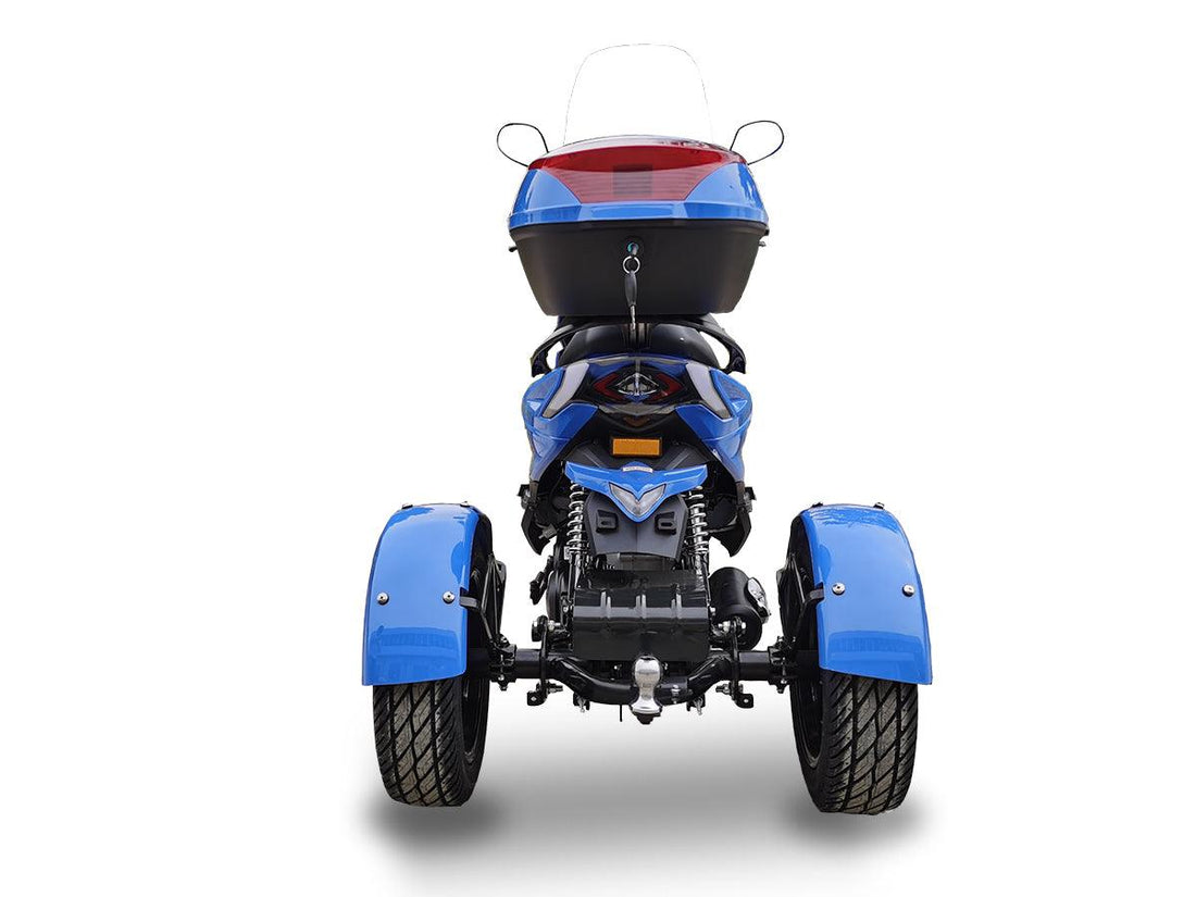 Rear view of blue youth three-wheeled ATV with black cargo box and fenders on white background