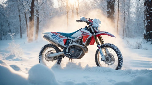 Off-road dirt bike covered in snow parked in a snowy winter forest