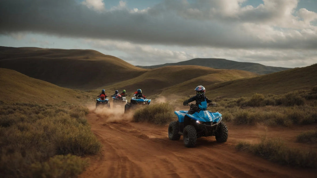 Kids riding blue ATVs on a dirt trail in open countryside hills