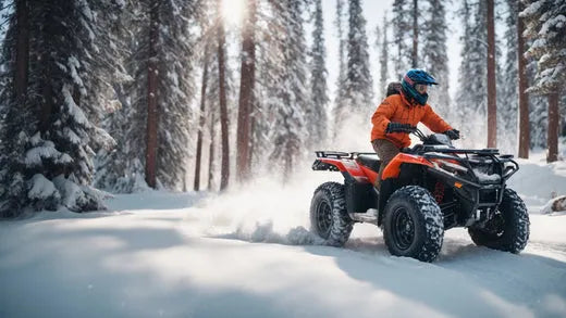 Rider on orange ATV driving through snowy forest trail in winter