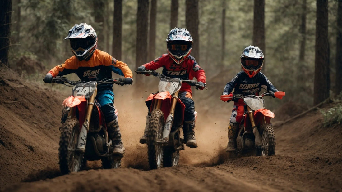 Three kids riding dirt bikes on a forest trail, wearing helmets and motocross gear