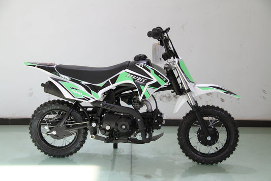 Youth dirt bike with knobby tires, green and black graphics, off-road mini motorcycle