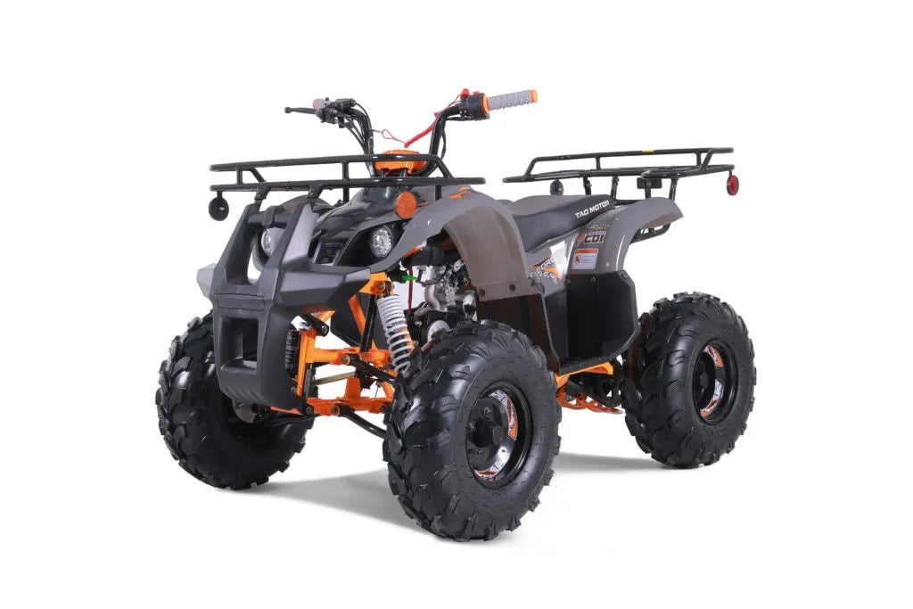 Dark gray and orange all-terrain vehicle ATV with large off-road tires, front and rear racks.