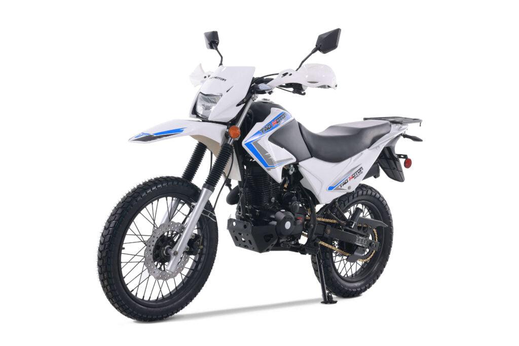 White dual sport motorcycle with blue accents, off-road tires, and high front fender