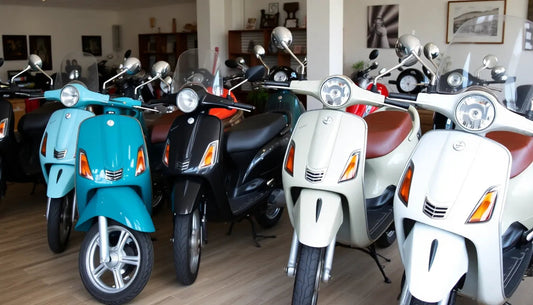 Row of colorful scooters with windshields displayed indoors on showroom floor