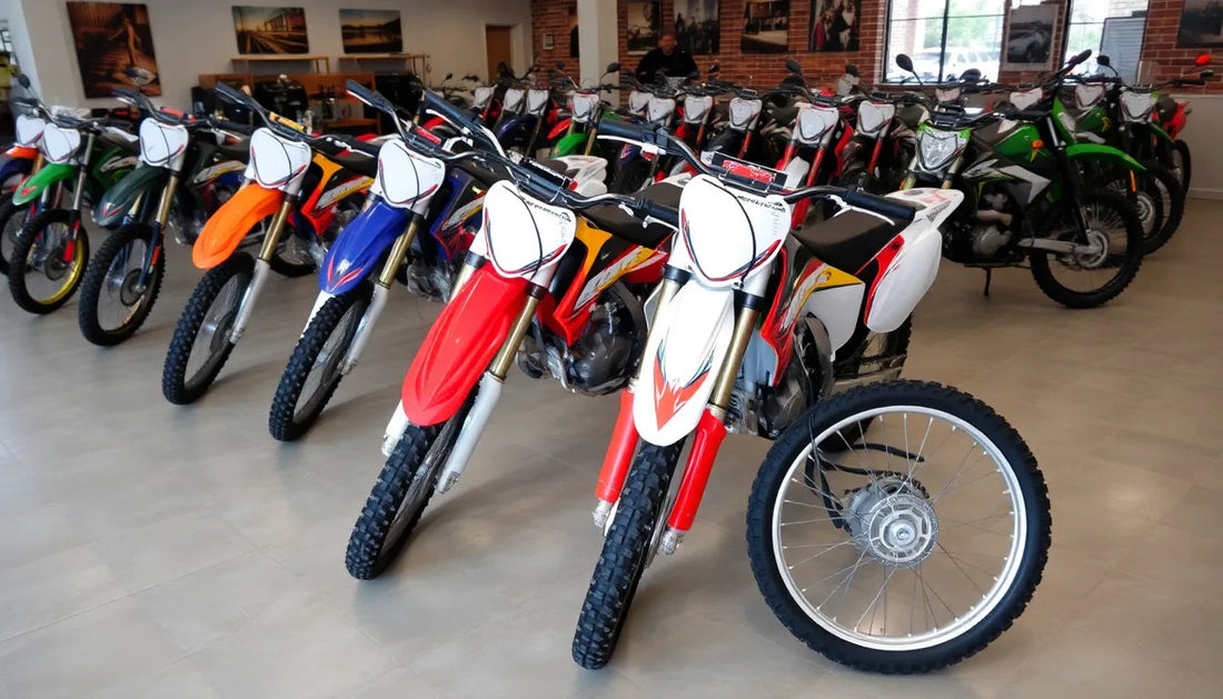 Showroom display of multiple off-road dirt bikes with colorful graphics and knobby tires