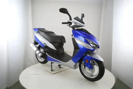 Blue and silver gas scooter with sport design, displayed indoors on a white platform
