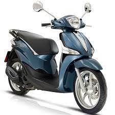 Blue Piaggio motor scooter with chrome accents on a white background, affordable scooter
