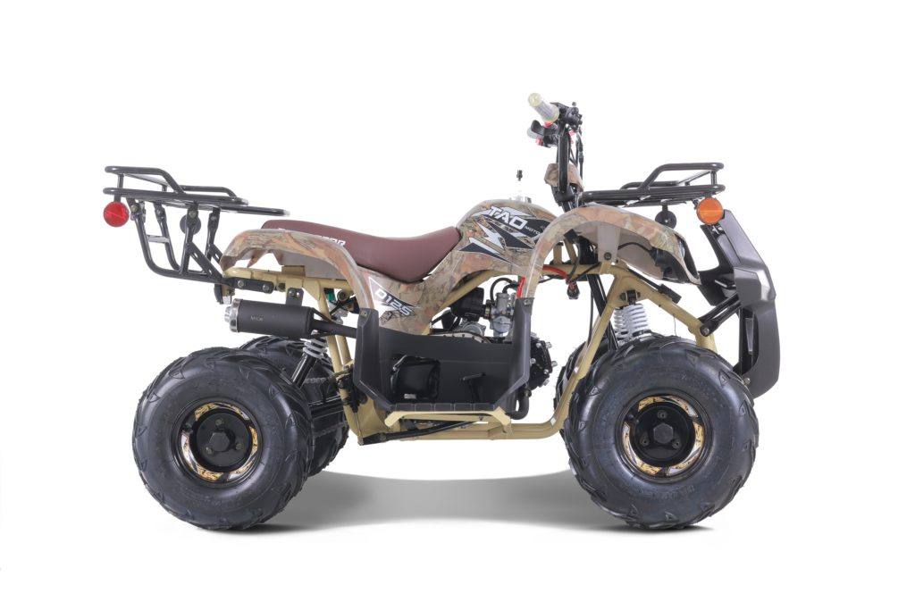 Camo youth utility ATV with rugged tires and cargo racks on white background