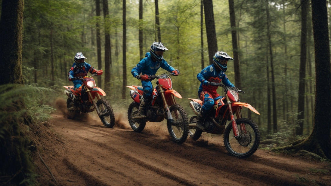 Three riders on red dirt bikes trail riding in a forest, wearing blue and red gear