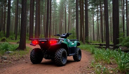 Green ATV on a dirt trail in a forest, off-road four wheeler for outdoor adventure