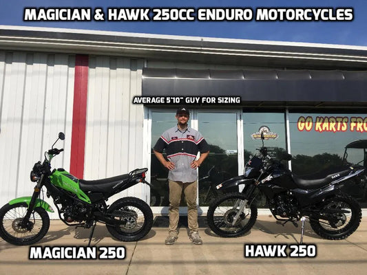 Man standing between Magician 250 and Hawk 250 enduro motorcycles for size comparison