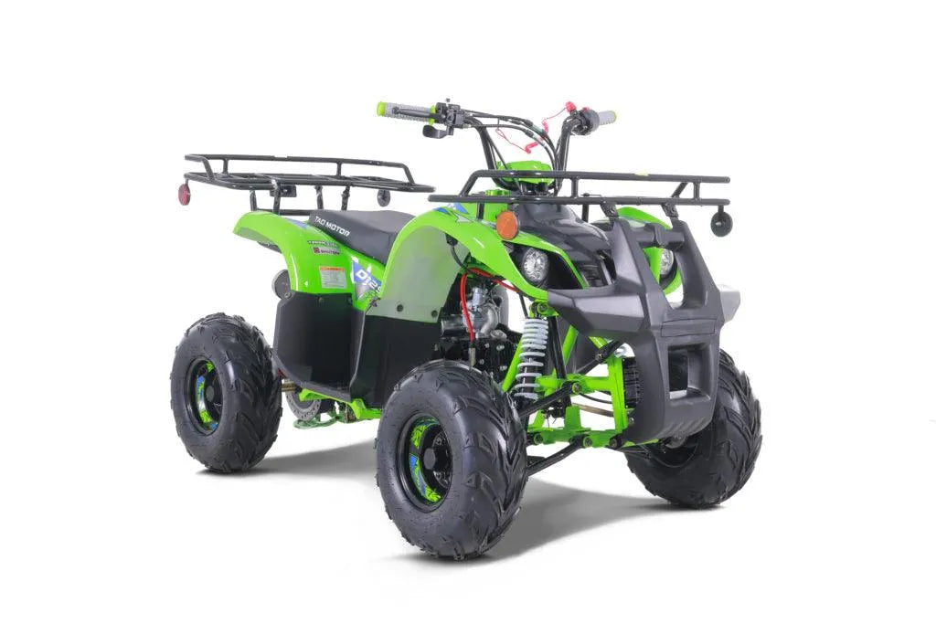 Green four-wheel ATV with rugged tires, front and rear racks, off-road vehicle on white background