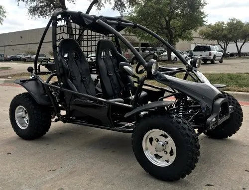 Black off-road go-kart with two seats and rugged tires parked outdoors