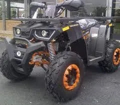 Black and orange ATV with rugged tires parked outdoors, all-terrain vehicle for beginners and adults