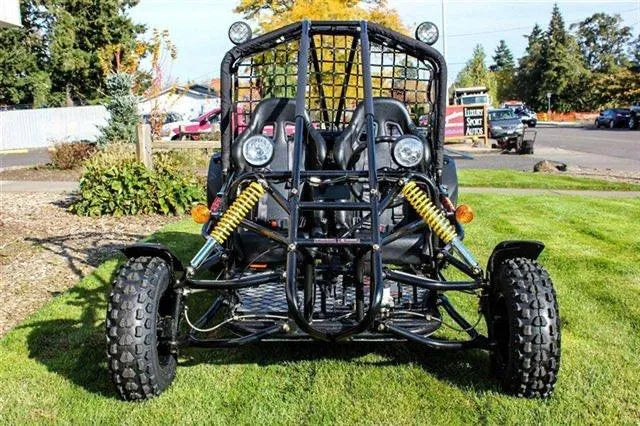 Front view of off-road go-kart with rugged tires, dual seats, and yellow suspension springs
