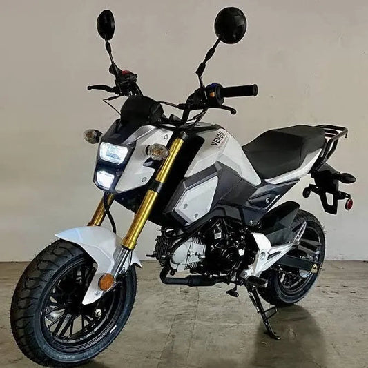 White mini street bike motorcycle with LED lights and black accents on an indoor concrete floor