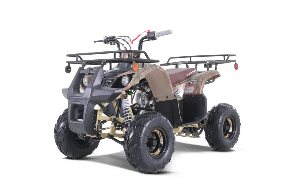 Youth camo ATV with rugged tires, front and rear cargo racks, and off-road features
