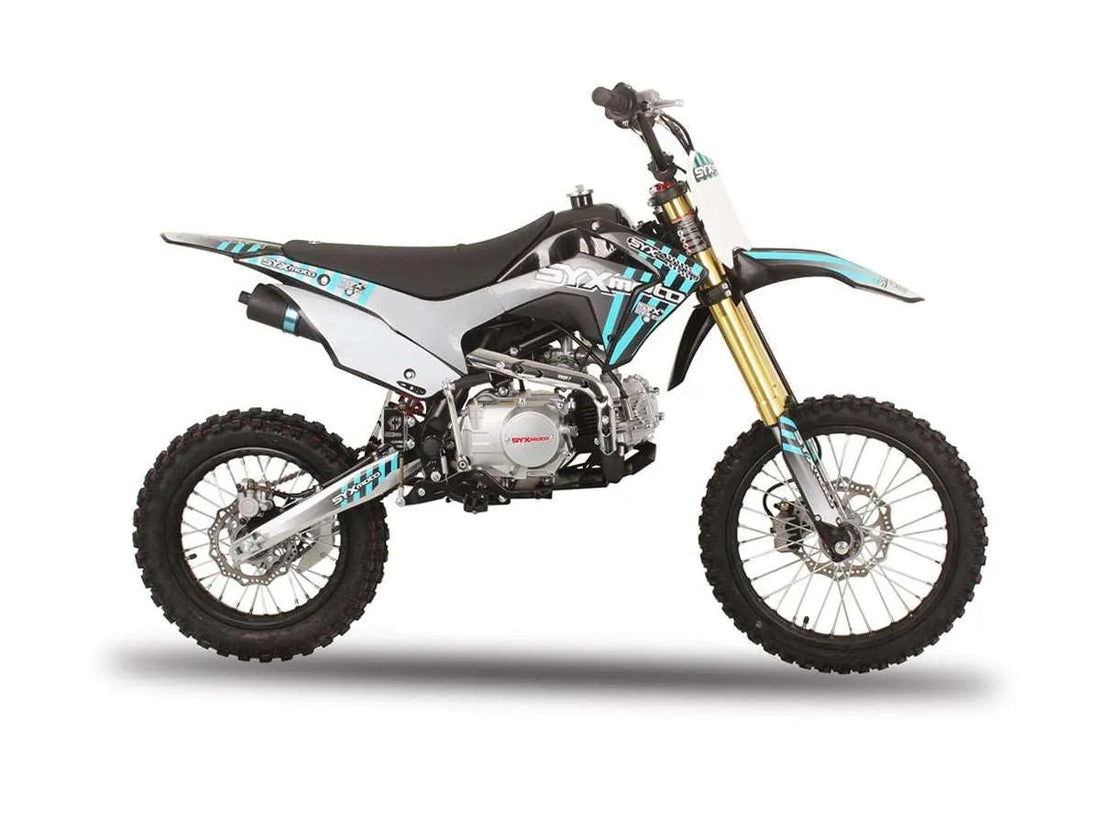 Youth dirt bike with off-road tires and blue, black, and white graphics on white background
