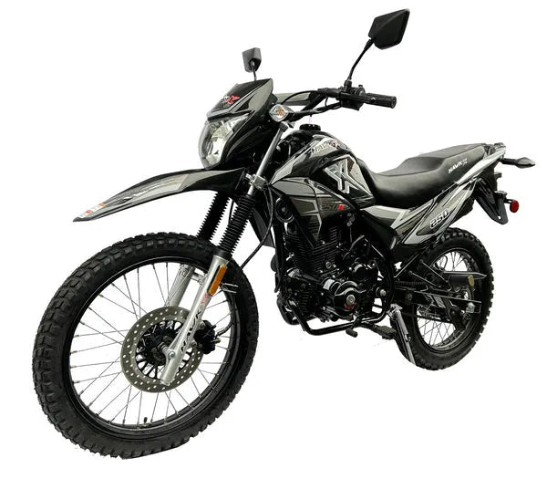 Black off-road dirt bike with knobby tires and angular bodywork on white background
