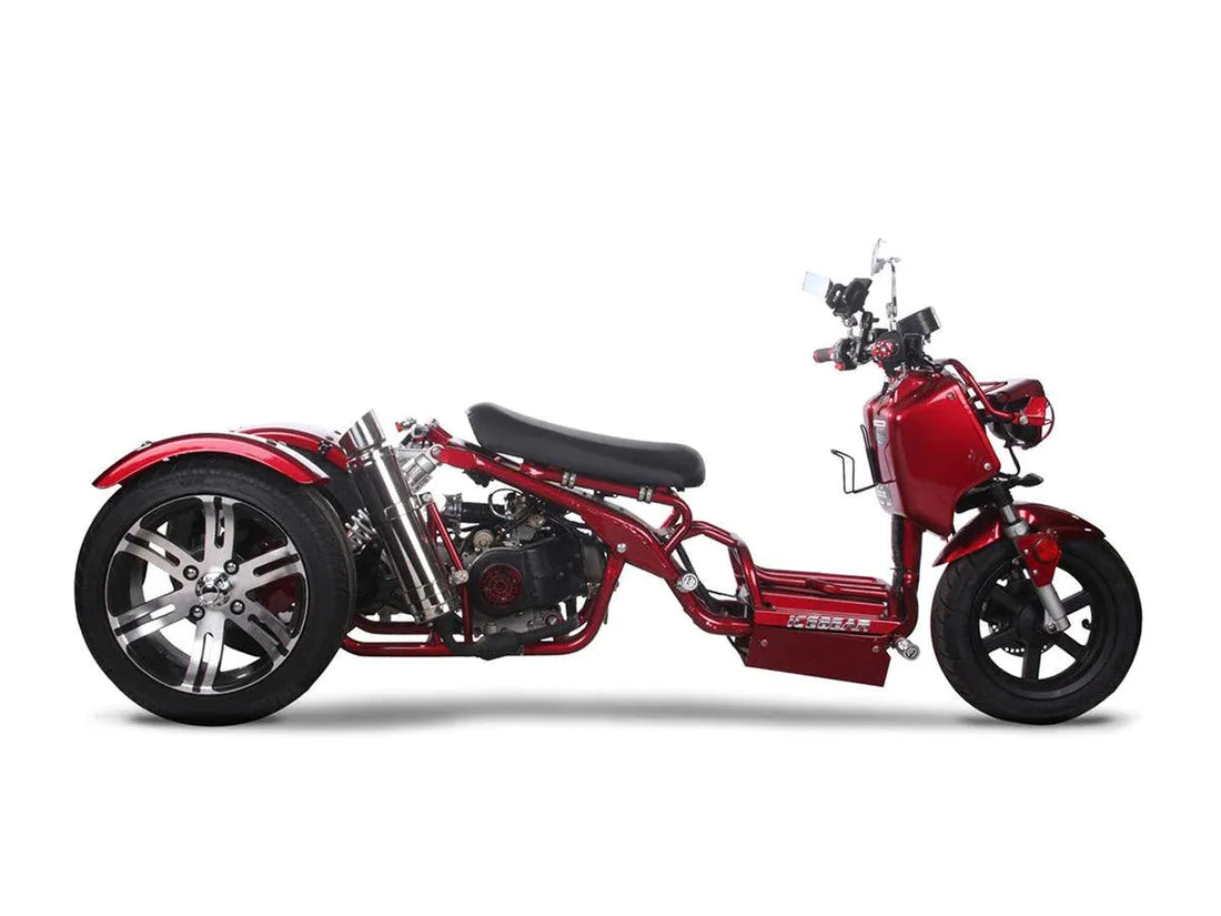 Red three-wheel trike scooter with low seat design, chrome accents, and large rear wheels.